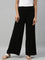 Women Solid Black Viscose Mid Rise Knit Palazzos