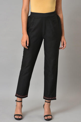 Black Slim Pants With Embroidery At Hemline