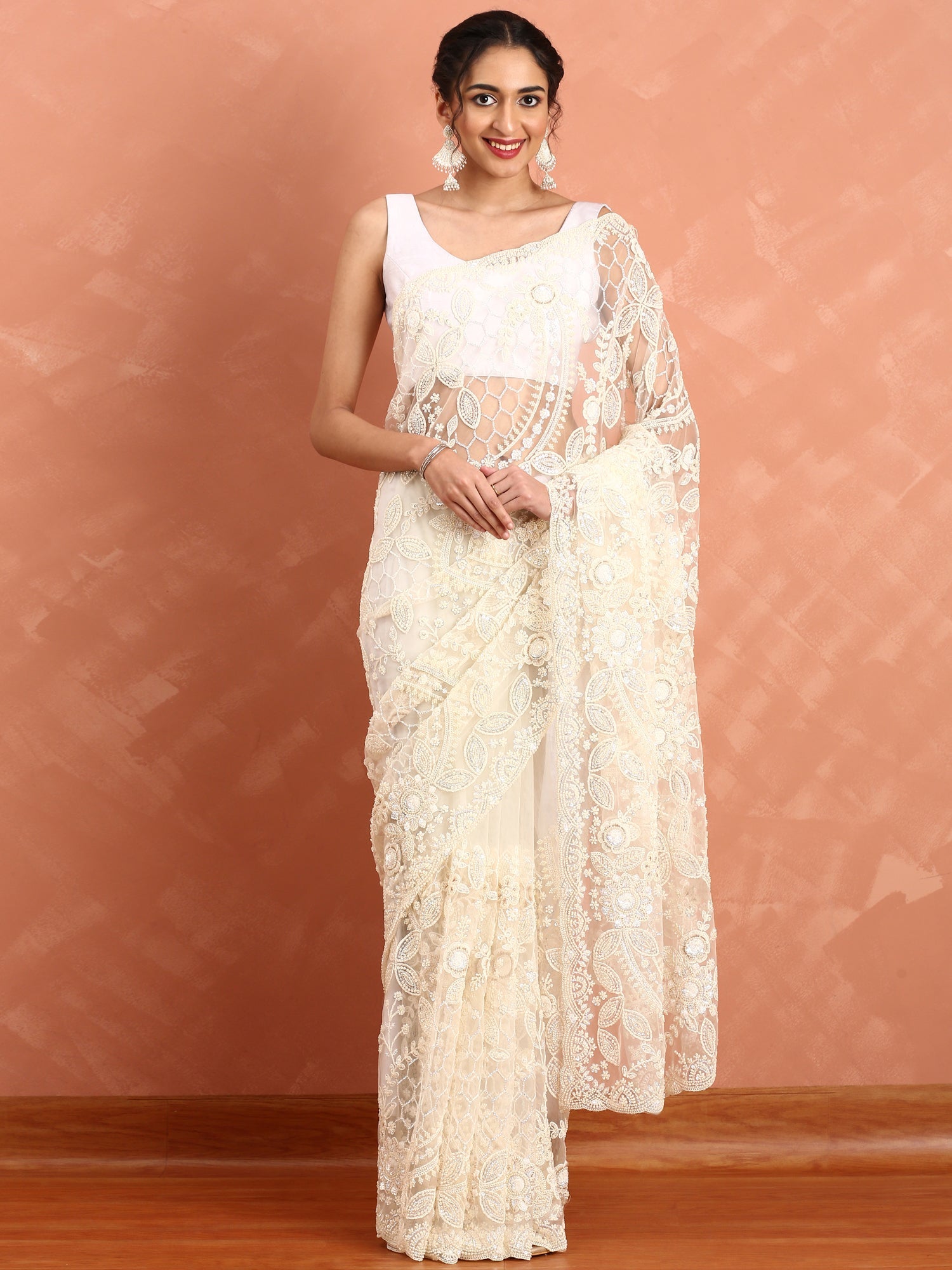 Cream net saree with pearl and sequins hand embroidery with scallop border