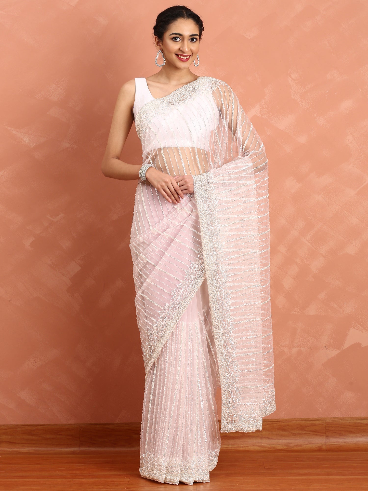 Baby pink net saree with cut Dana hand embroidery
