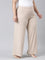 Women Solid Beige Mid Rise Ribbed Palazzos