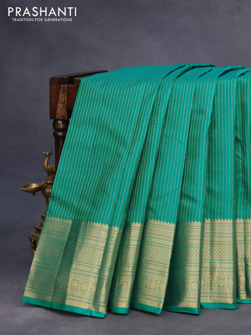 Pure kanchipuram silk saree teal green and pink with allover zari weaves and zari woven border