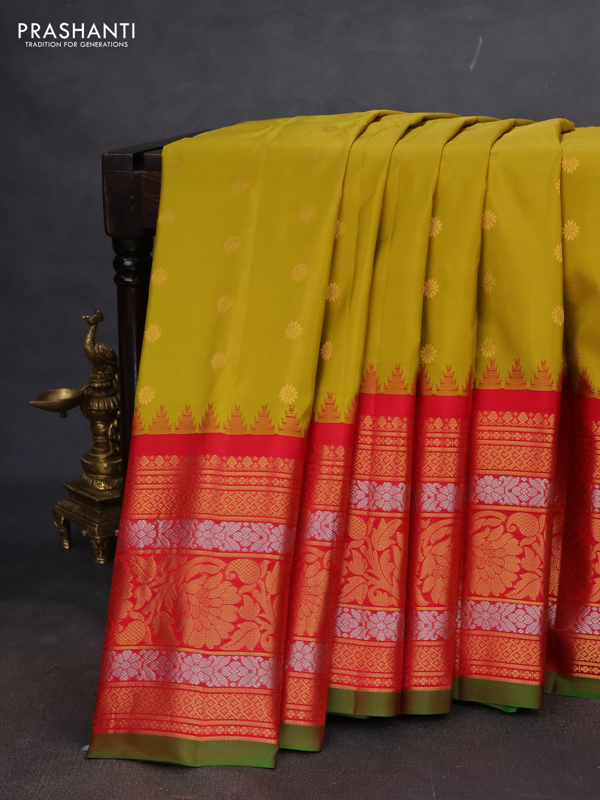 Pure gadwal silk saree mustard yellow and red with floral zari woven buttas and long temple design zari woven korvai border