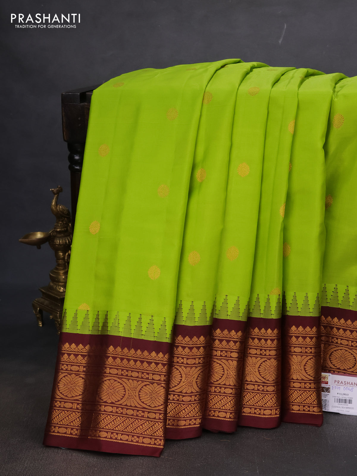 Pure gadwal silk saree light green and deep maroon with zari woven buttas and temple design zari woven korvai border