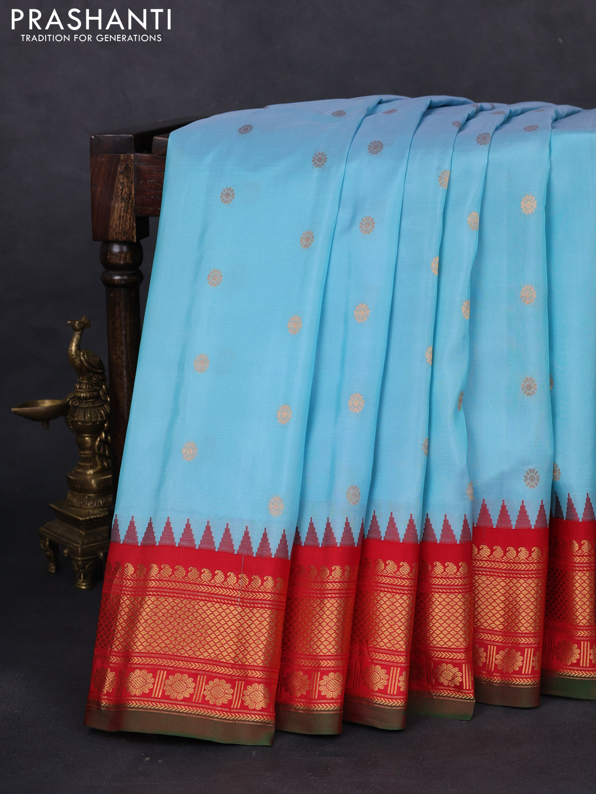 Pure gadwal silk saree light blue and red with floral zari woven buttas and temple design zari woven border