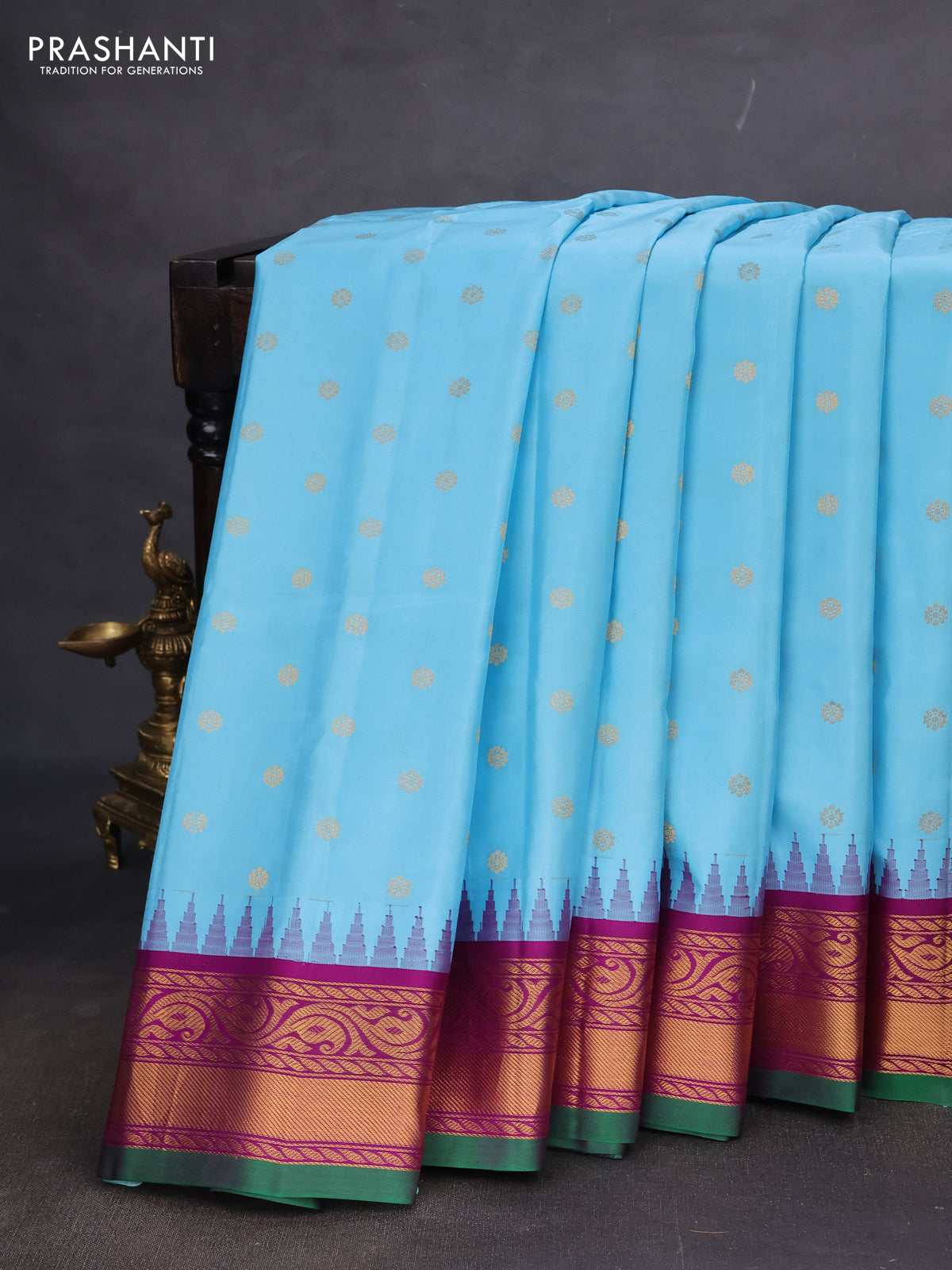 Pure gadwal silk saree light blue and purple with allover zari woven buttas and temple design zari woven border