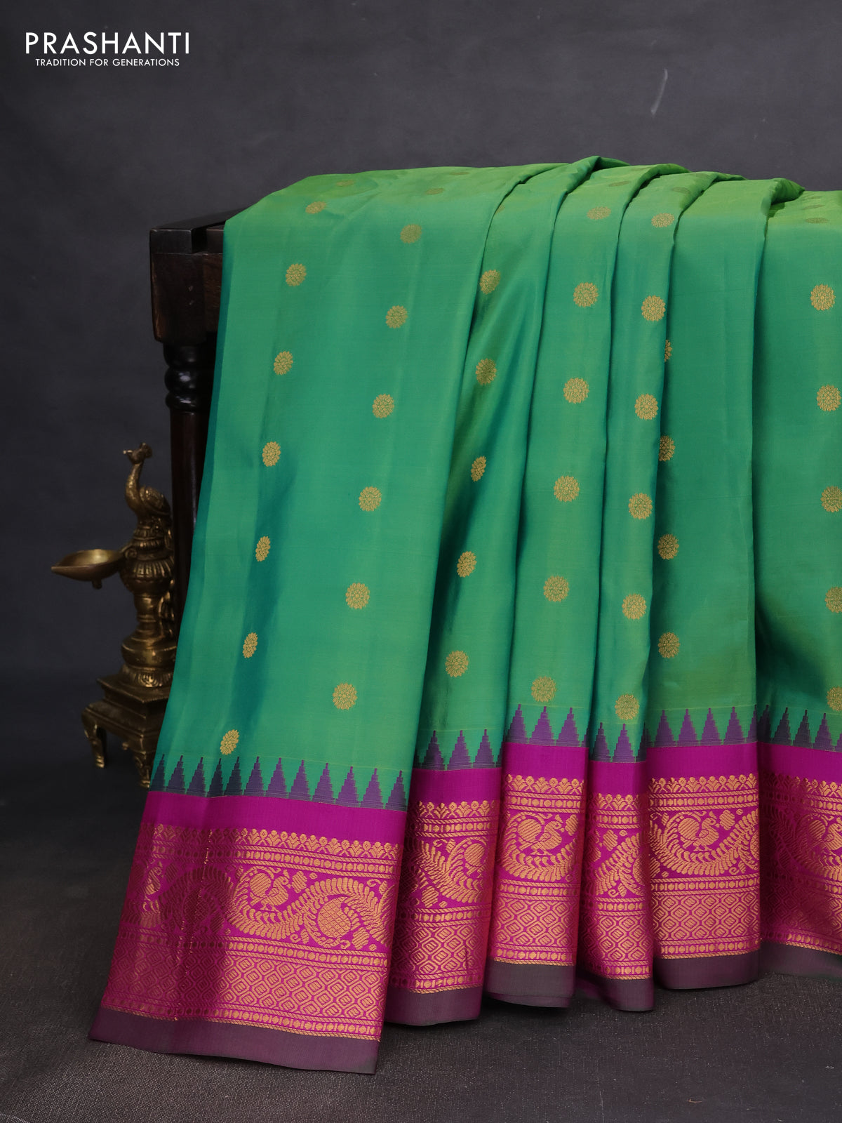 Pure gadwal silk saree green and purple with allover zari woven buttas and temple design zari woven border