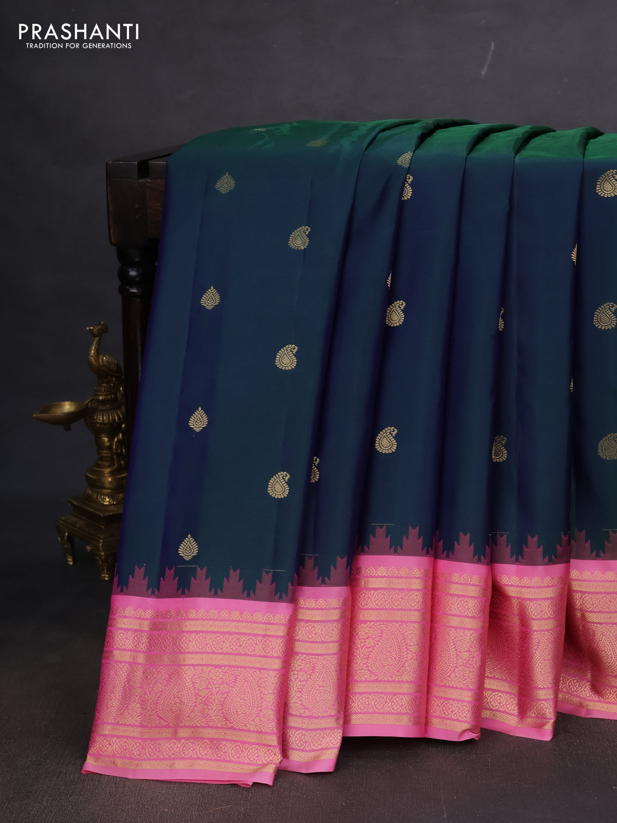 Pure gadwal silk saree dual shade of bluish green and light pink with paisley zari woven buttas and temple design zari woven border