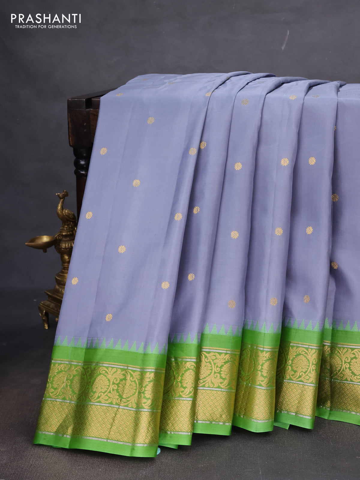 Pure gadwal silk saree grey and light green with zari woven buttas and temple design zari woven korvai border