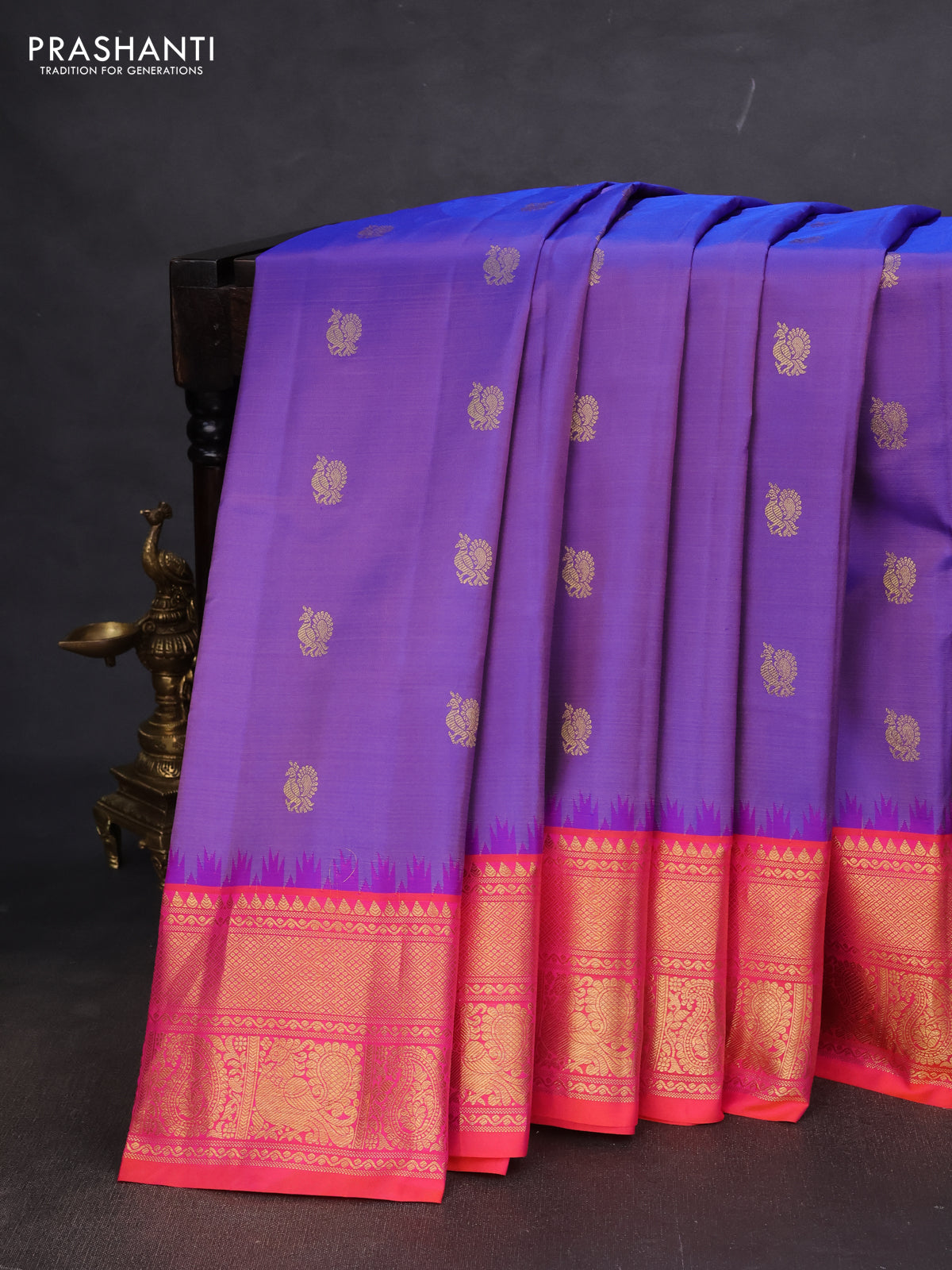 Pure gadwal silk saree lavender shade and dual shade of pinkish orange with annam zari woven buttas and temple design zari woven border