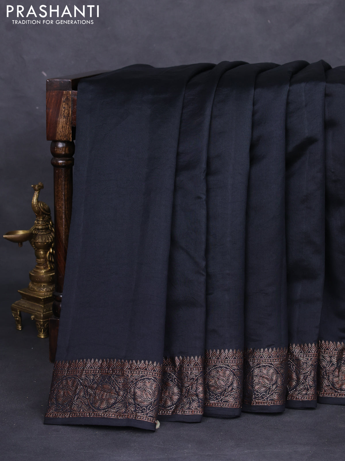 Chiniya silk saree black with plain body and woven border