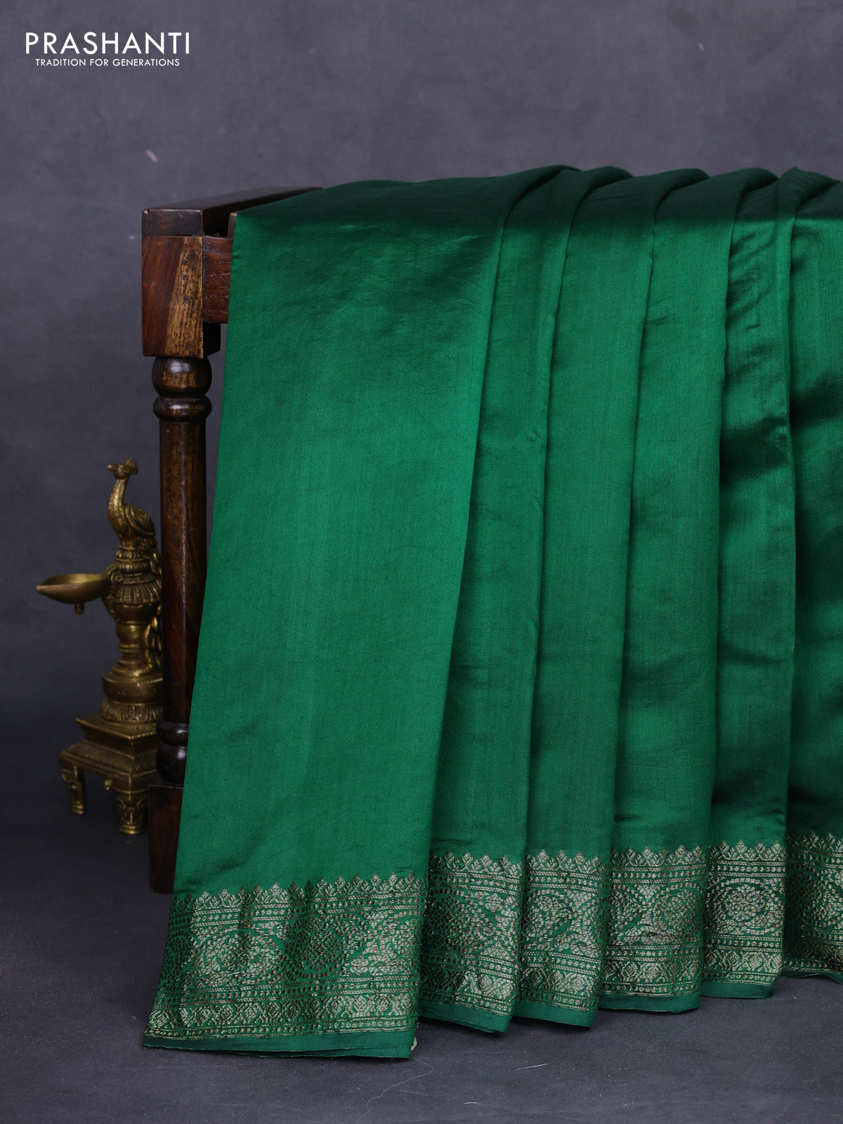Chiniya silk saree green with plain body and woven border
