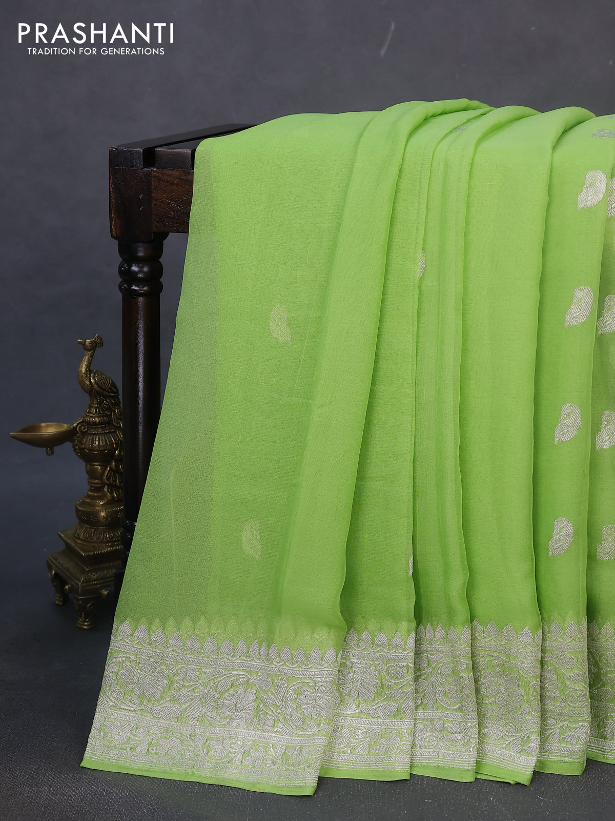 Banarasi chiffon silk saree light green with paisley silver zari woven buttas and silver zari woven border