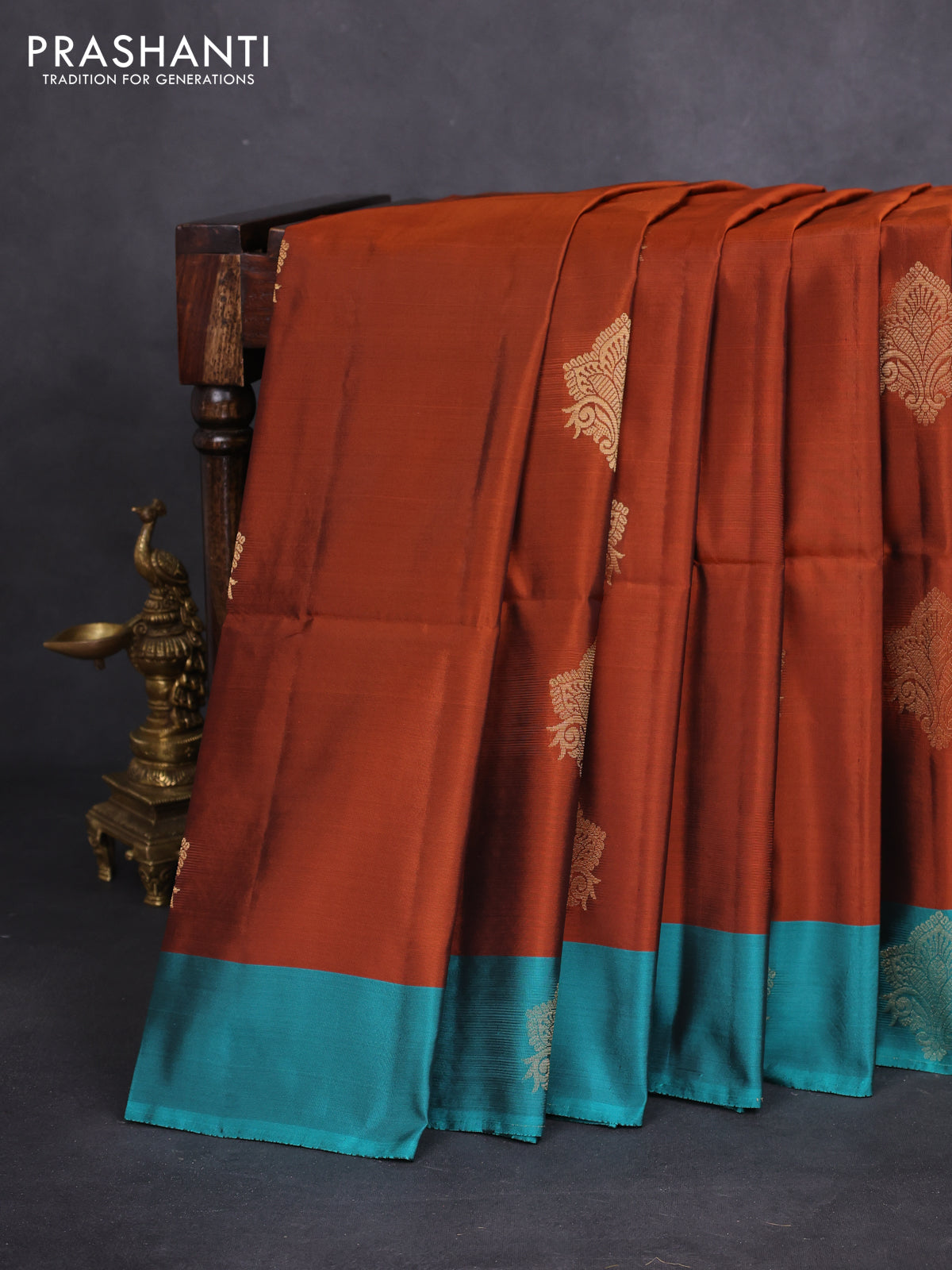 Kanchipuram soft silk saree rust shade and teal green with zari woven buttas and zari woven butta border