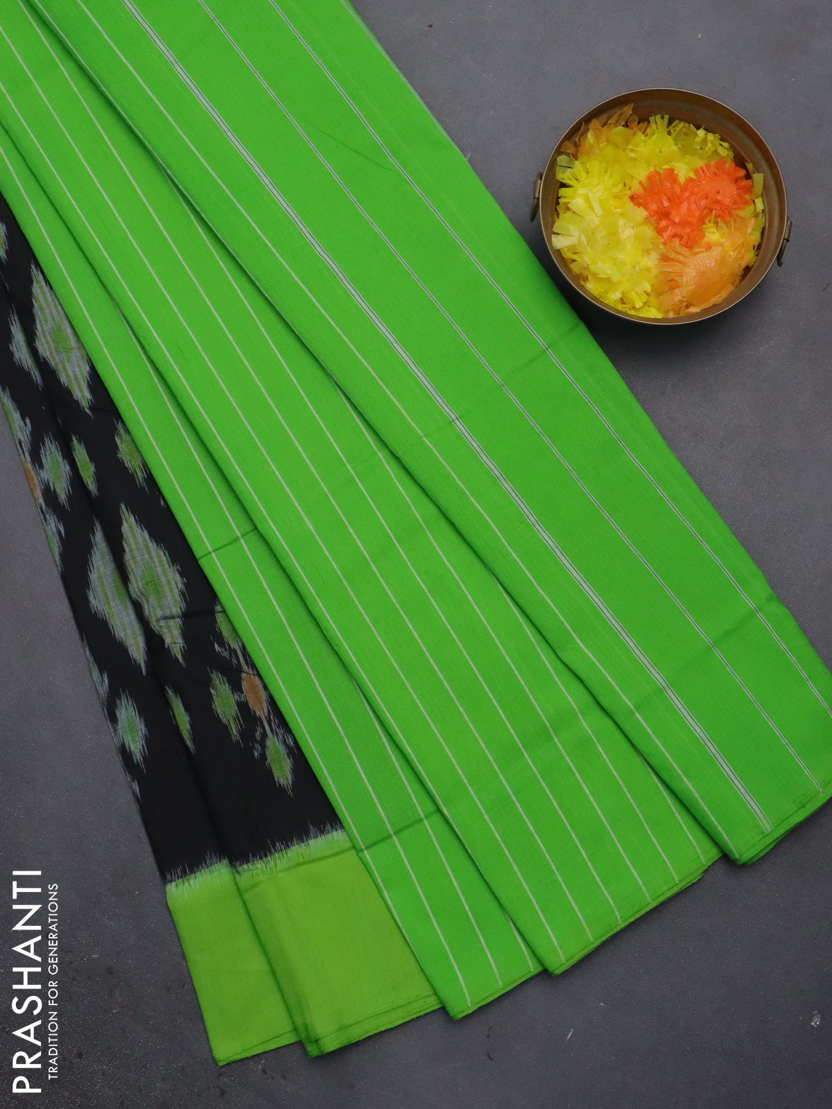 Ikat cotton saree black and green with allover ikat butta weaves and simple border