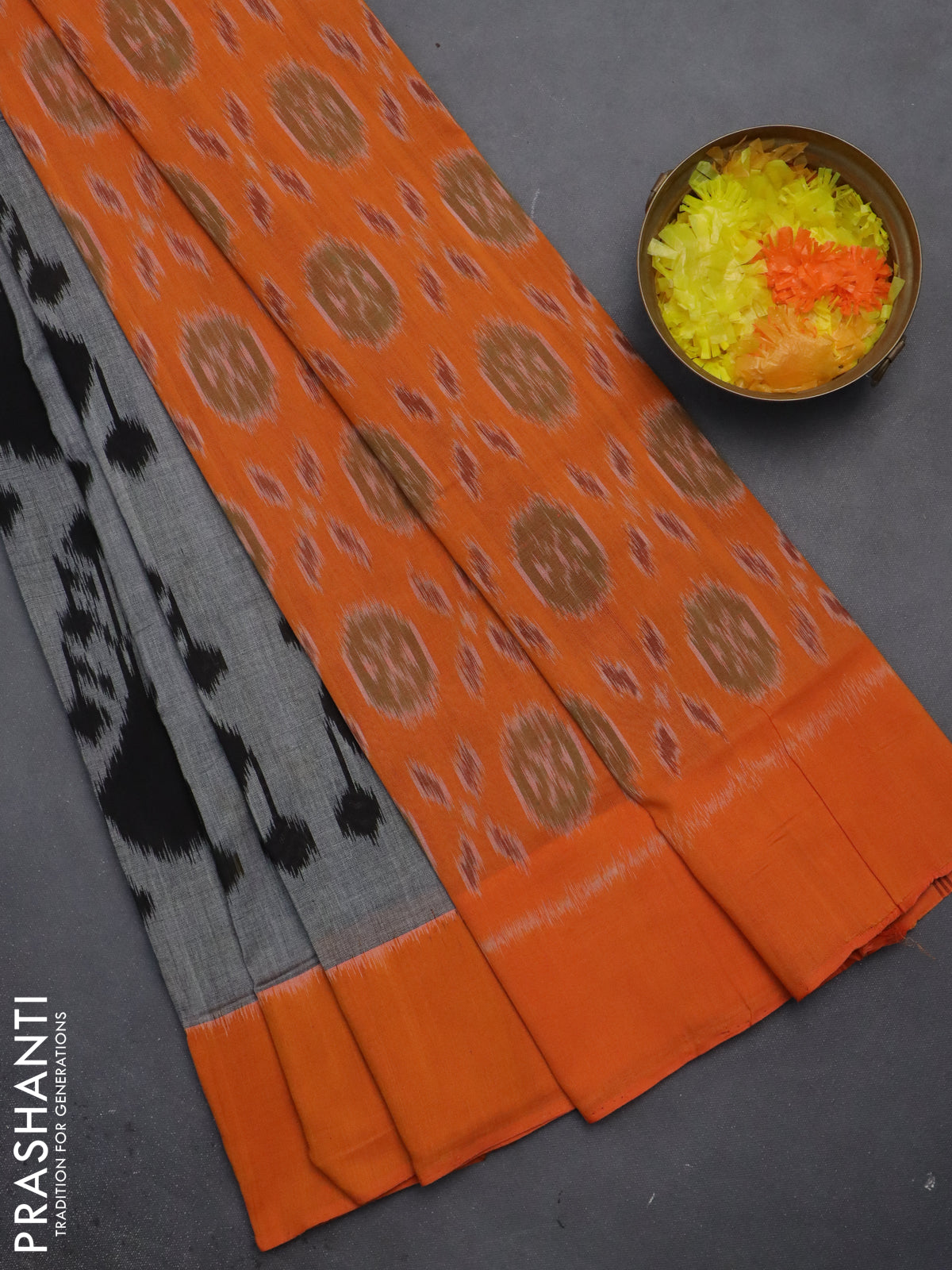 Ikat cotton saree grey and orange with allover ikat weaves and simple border