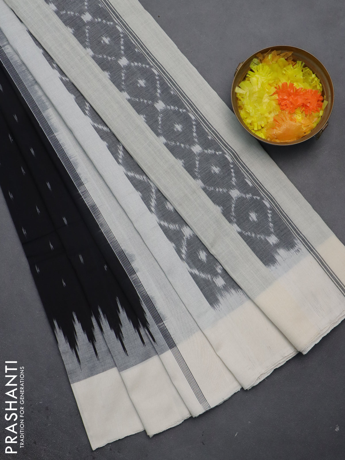 Ikat cotton saree black and off white with allover ikat butta weaves and temple design simple border