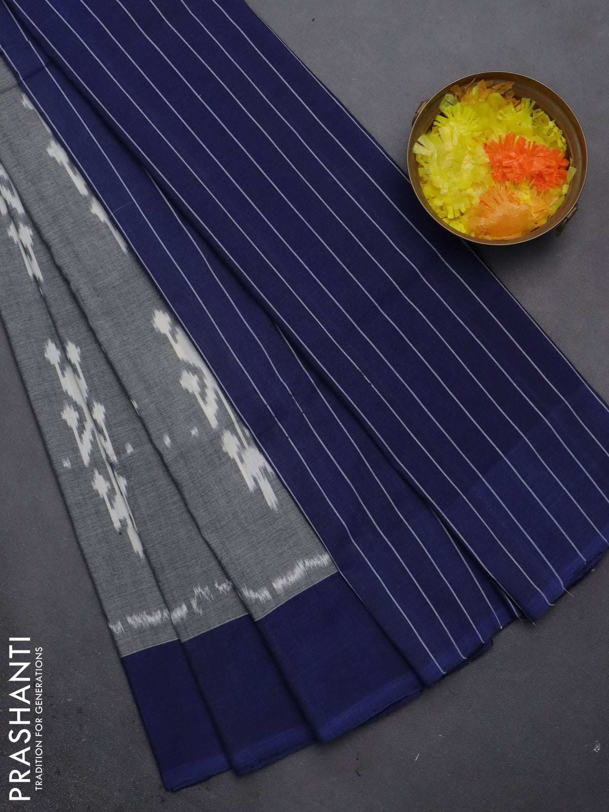 Ikat cotton saree grey and blue with allover ikat butta weaves and simple border