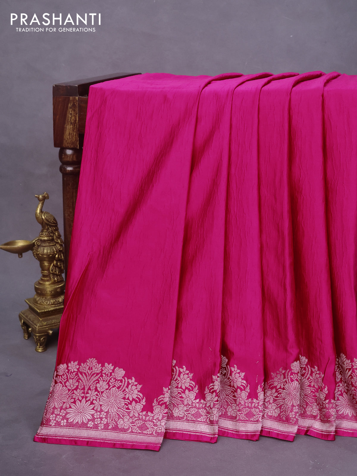 Banarasi crush crepe saree pink with plain body and silver zari woven floral border