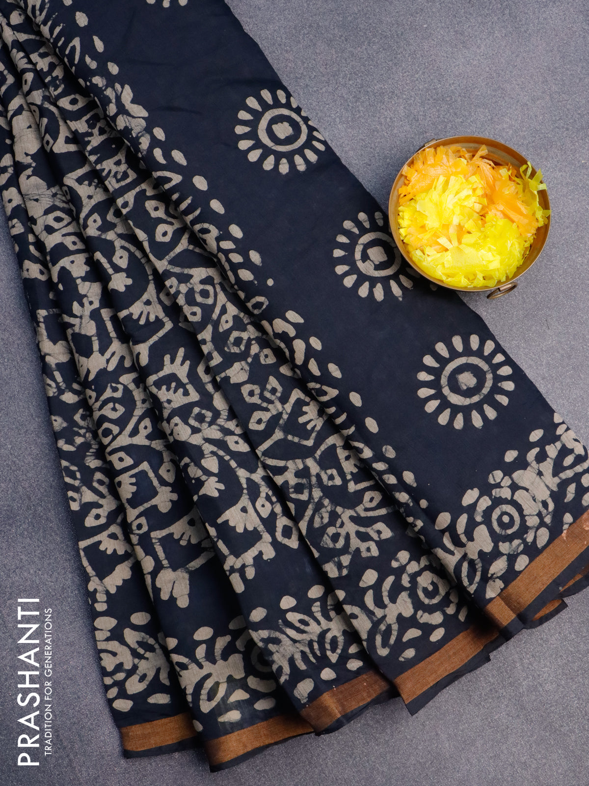 Muslin cotton saree black with allover batik prints and small zari woven border