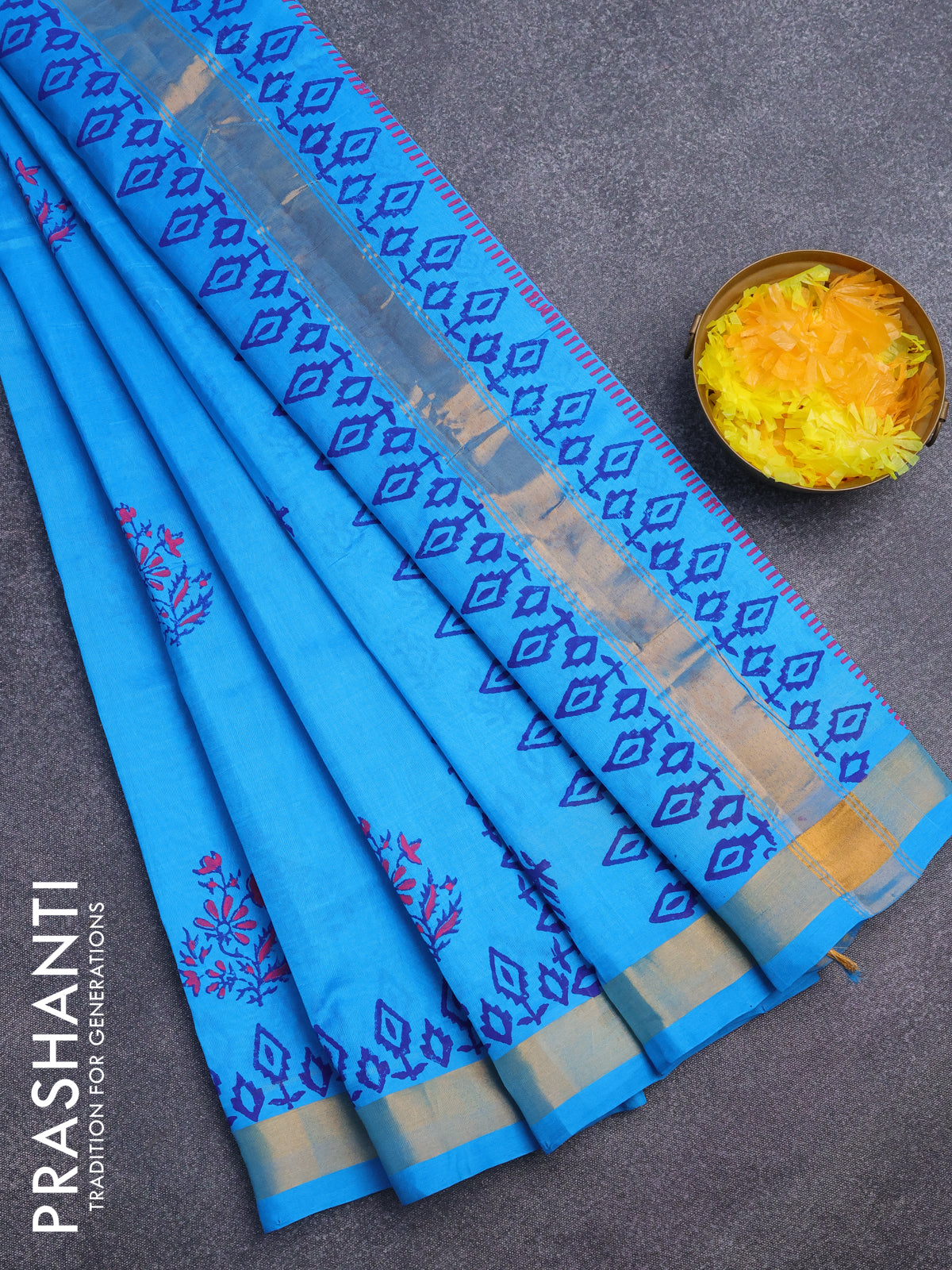 Silk cotton block printed saree cs blue with allover prints and zari woven border