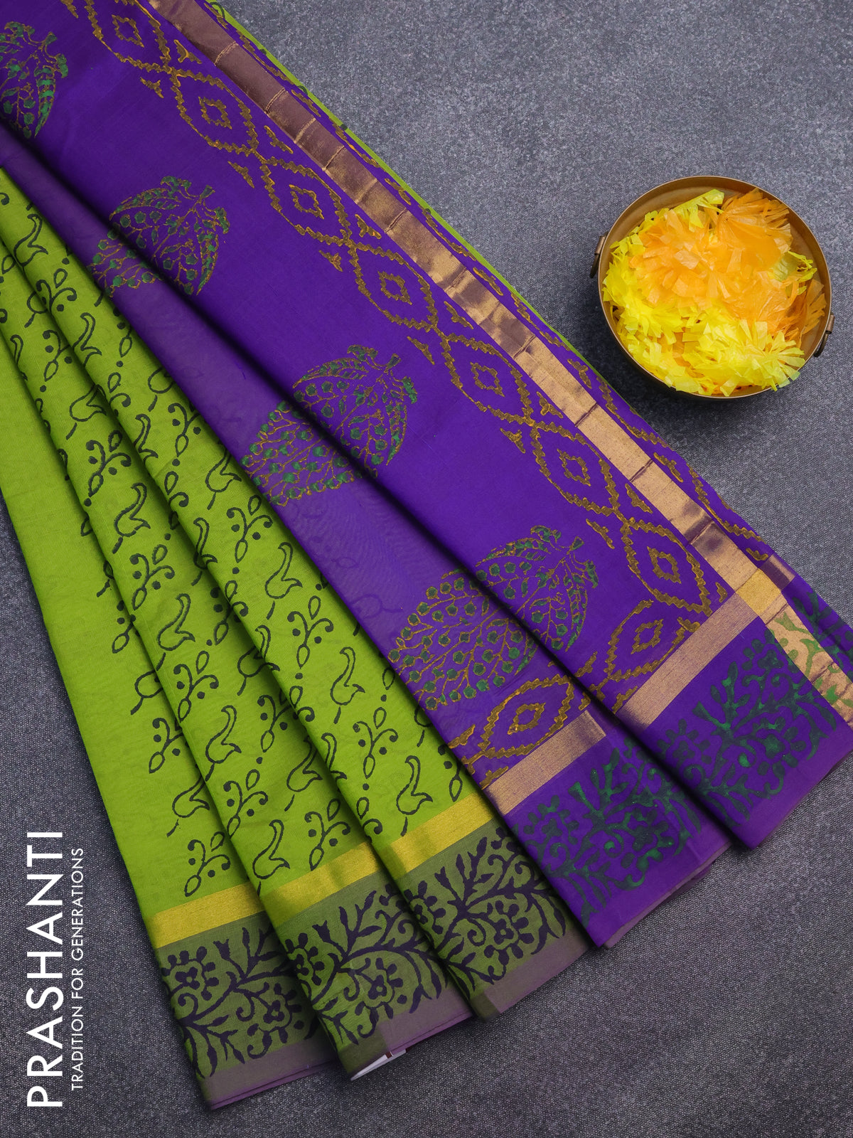 Silk cotton block printed saree light green and blue with allover prints and zari woven simple border