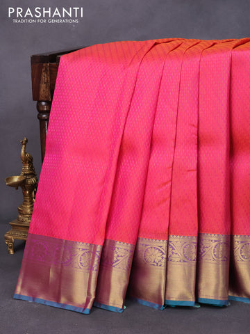 Pure kanjivaram silk saree dual shade of pinkish orange and teal blue with allover self emboss and floral design zari woven border