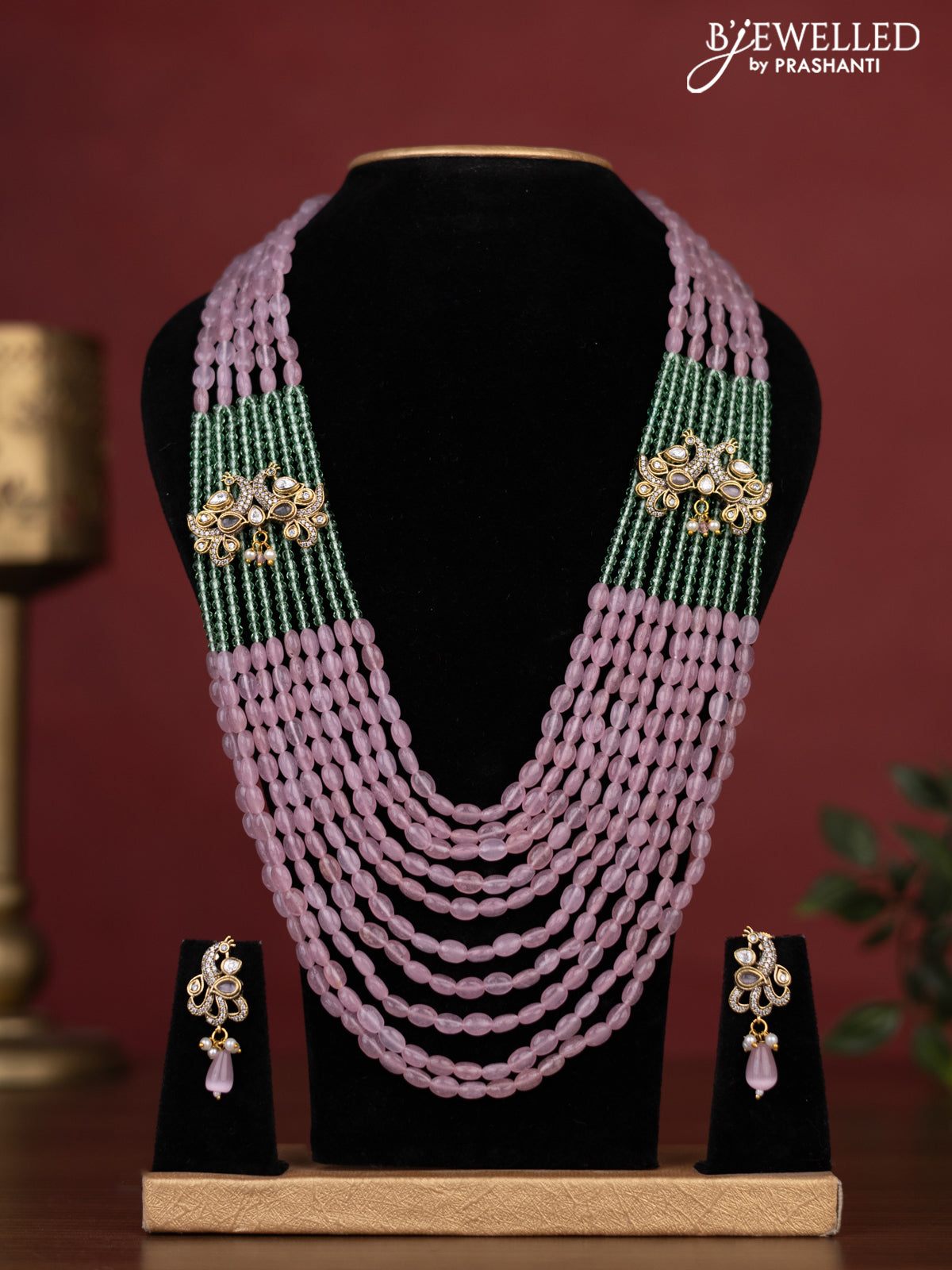 Beaded multilayer haaram with peacock side pendant and kundan & cz stones