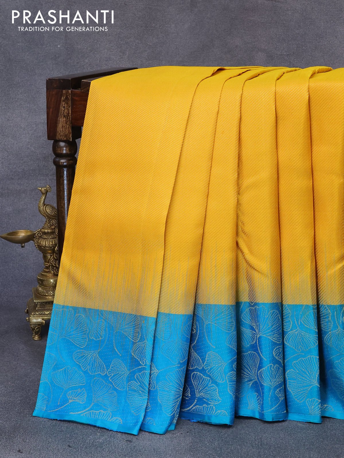 Pure soft silk saree yellow and dual shade of teal bluish green with allover zari weaves and leaf design zari woven border