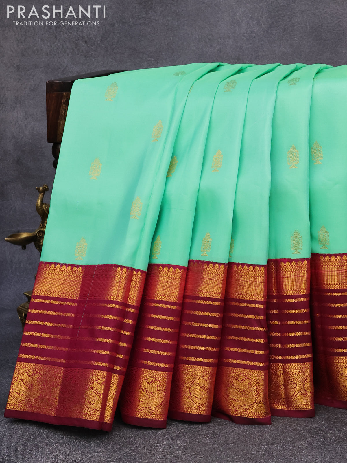 Pure kanjivaram silk saree teal green shade and dark magenta pink with allover zari woven annam buttas and long rich zari woven korvai border butta style