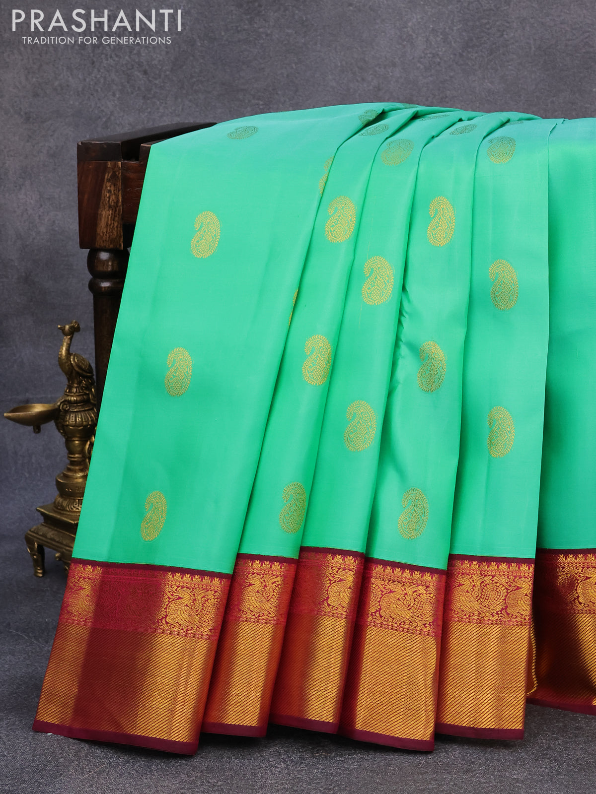 Pure kanjivaram silk saree teal green shade and dark magenta with paisley zari woven buttas and rich annam zari woven border butta style