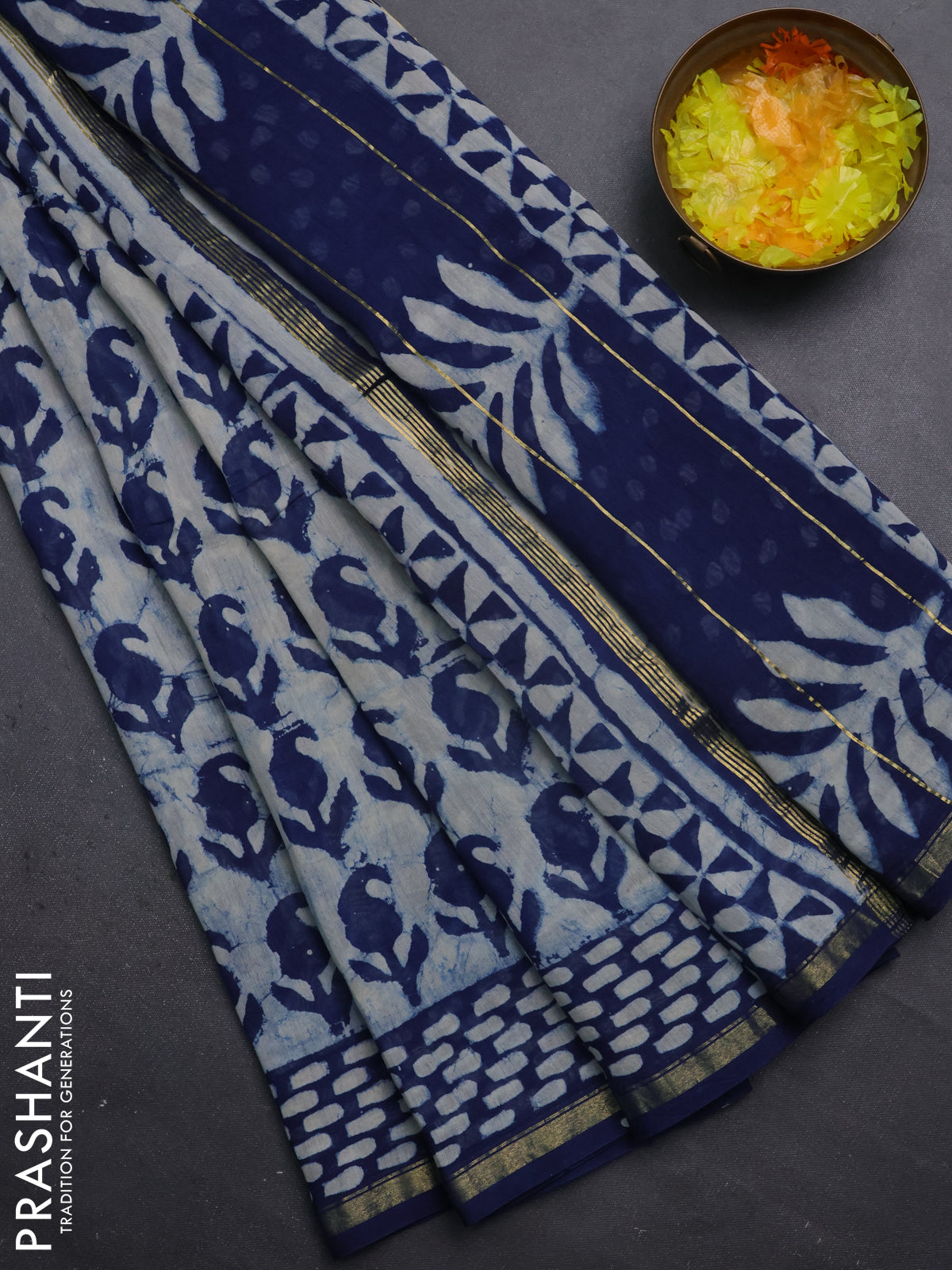Chanderi bagru saree beige and blue with allover dabu prints and small zari woven border