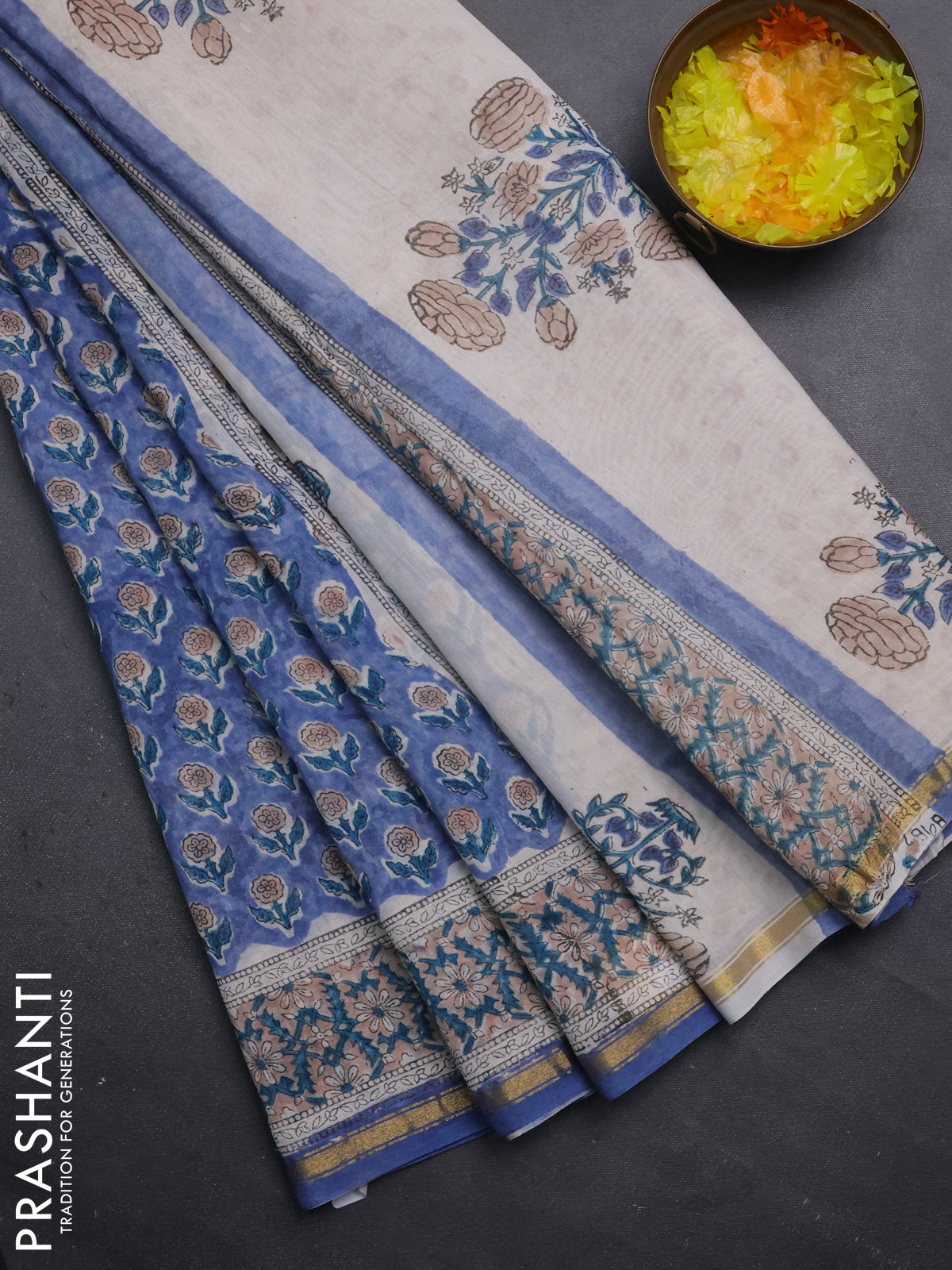 Chanderi bagru saree blue shade and off white with floral butta prints and small zari woven border