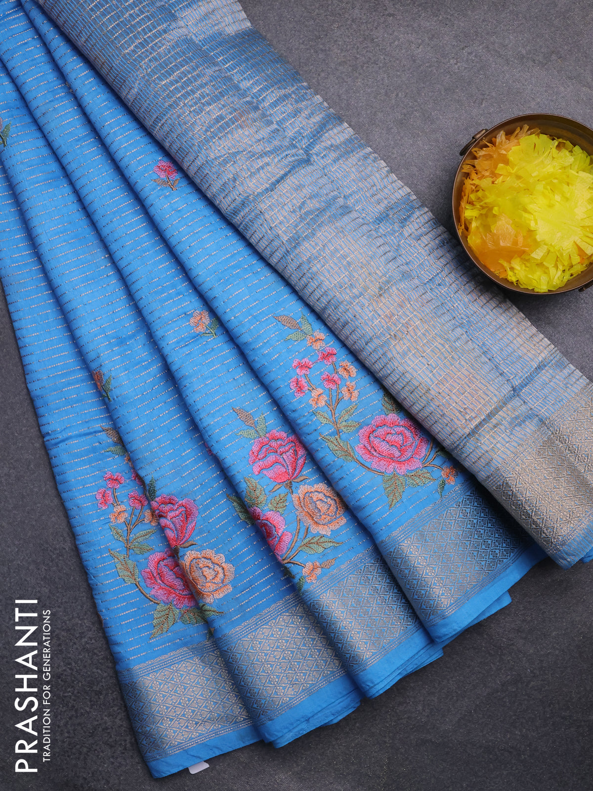 Assam silk saree light blue with allover zari weaves & floral embroidery work buttas and zari woven border