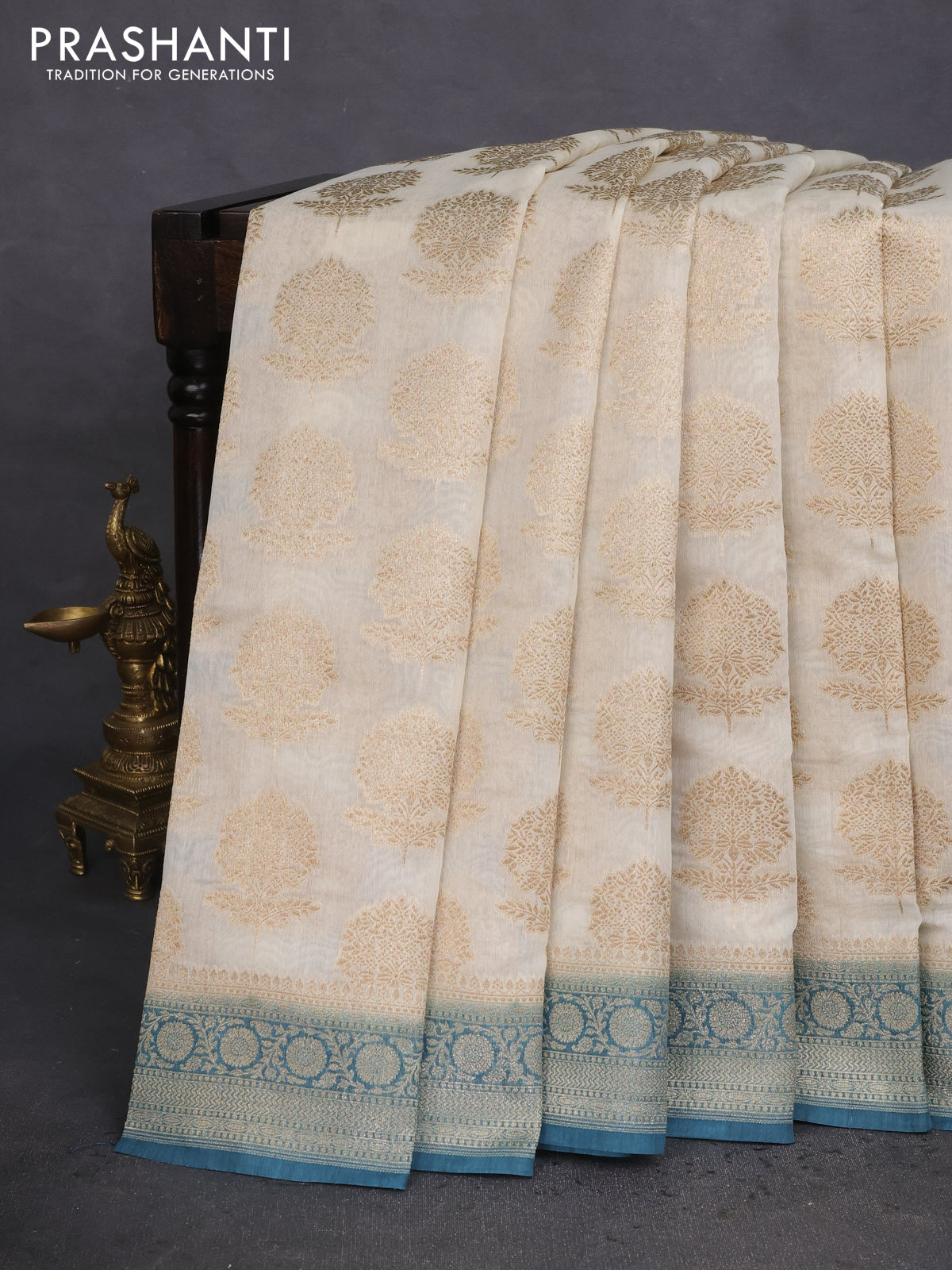 Banarasi silk cotton saree off white and peacock blue with allover thread & zari woven butta weaves and woven border