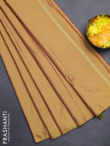 Arani semi silk saree dual shade of mustard with allover silver zari weaves in borderless style