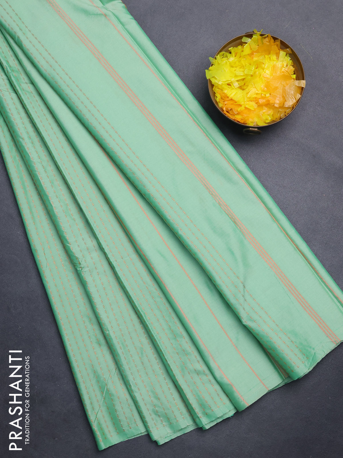 Arani semi silk saree pastel green with allover copper zari weaves in borderless style