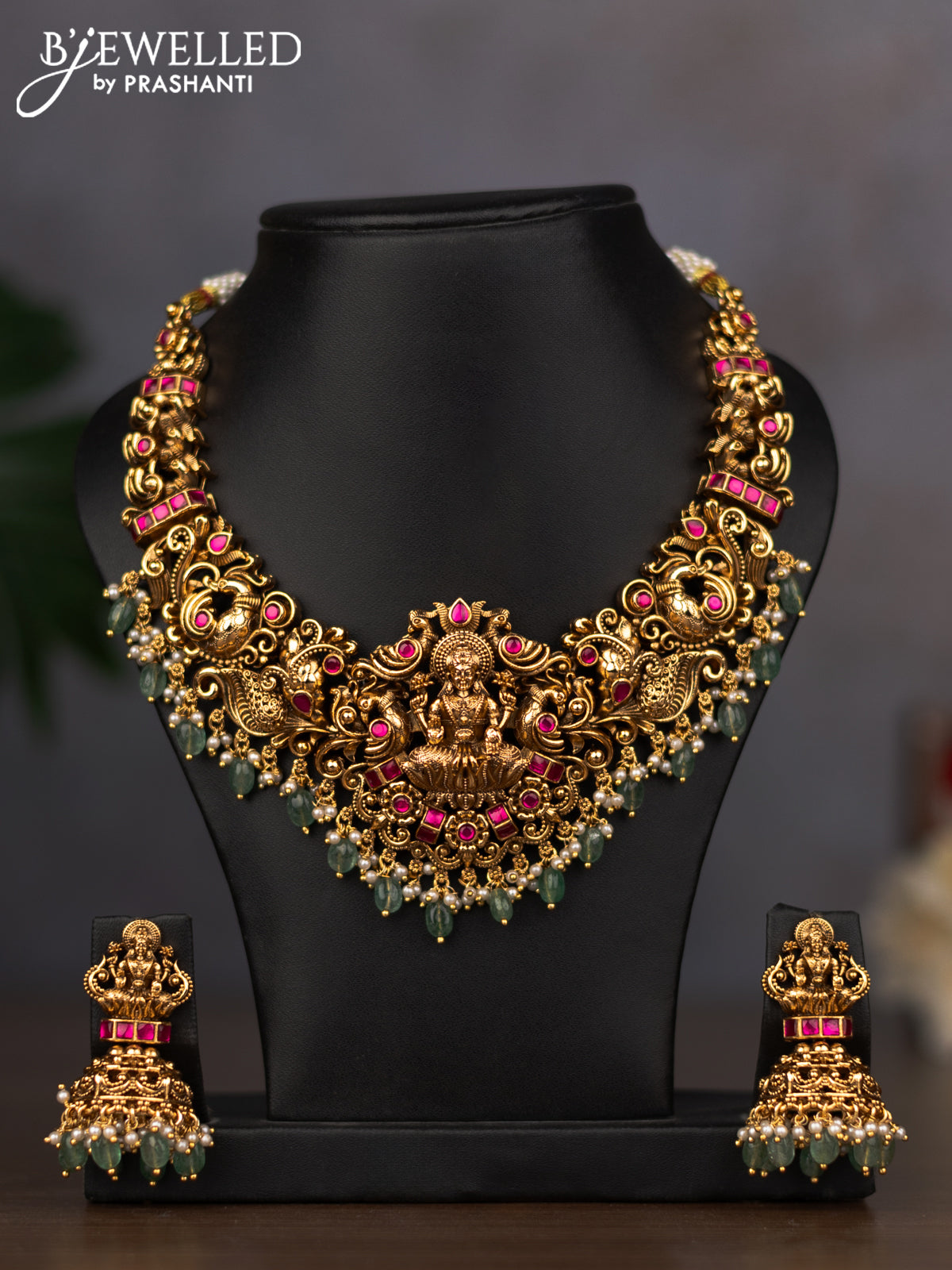 Antique necklace lakshmi design with pink jadau stones and green beads hanging