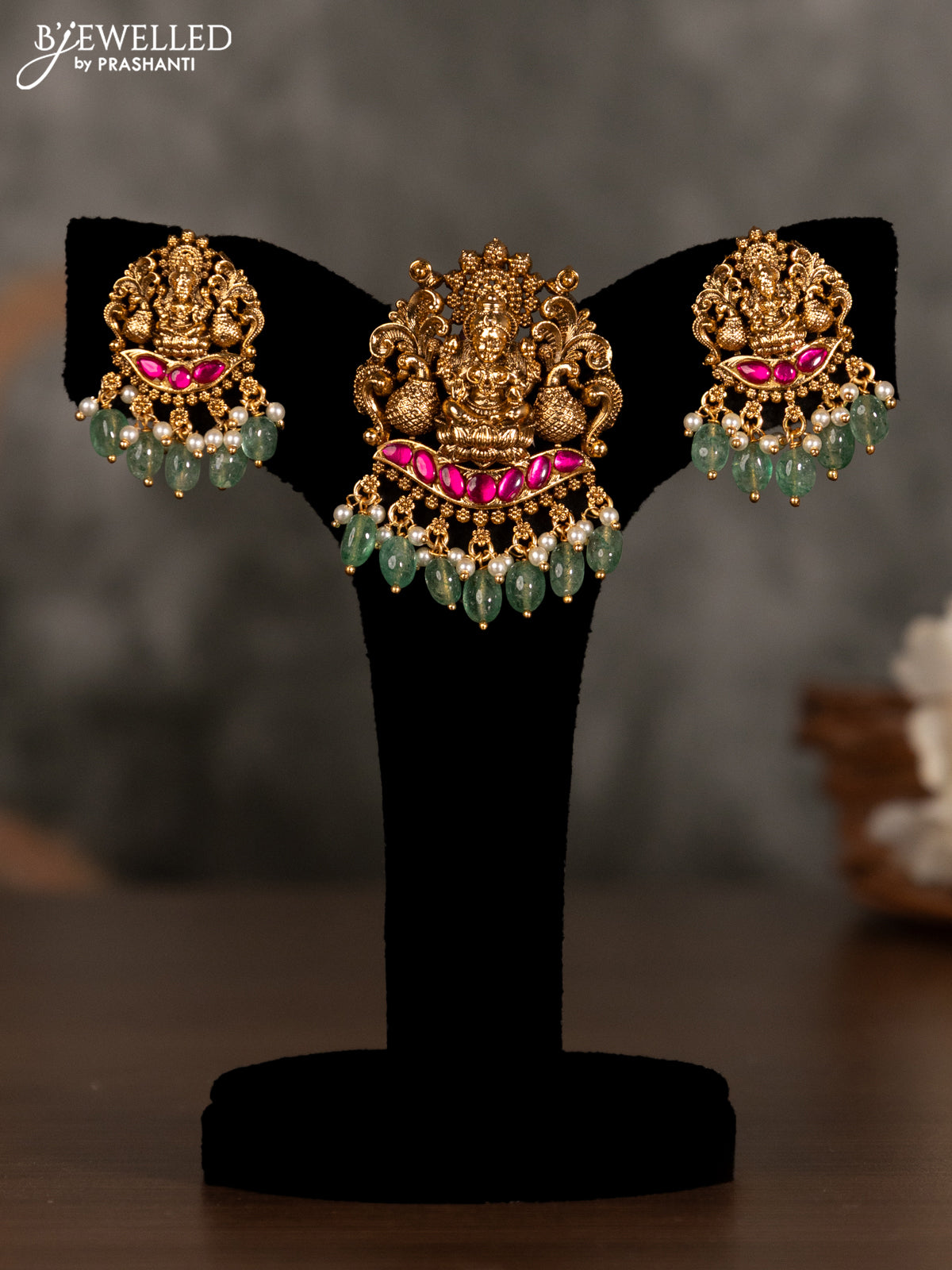 Antique pendant set lakshmi design with pink kemp stones and green beads hanging