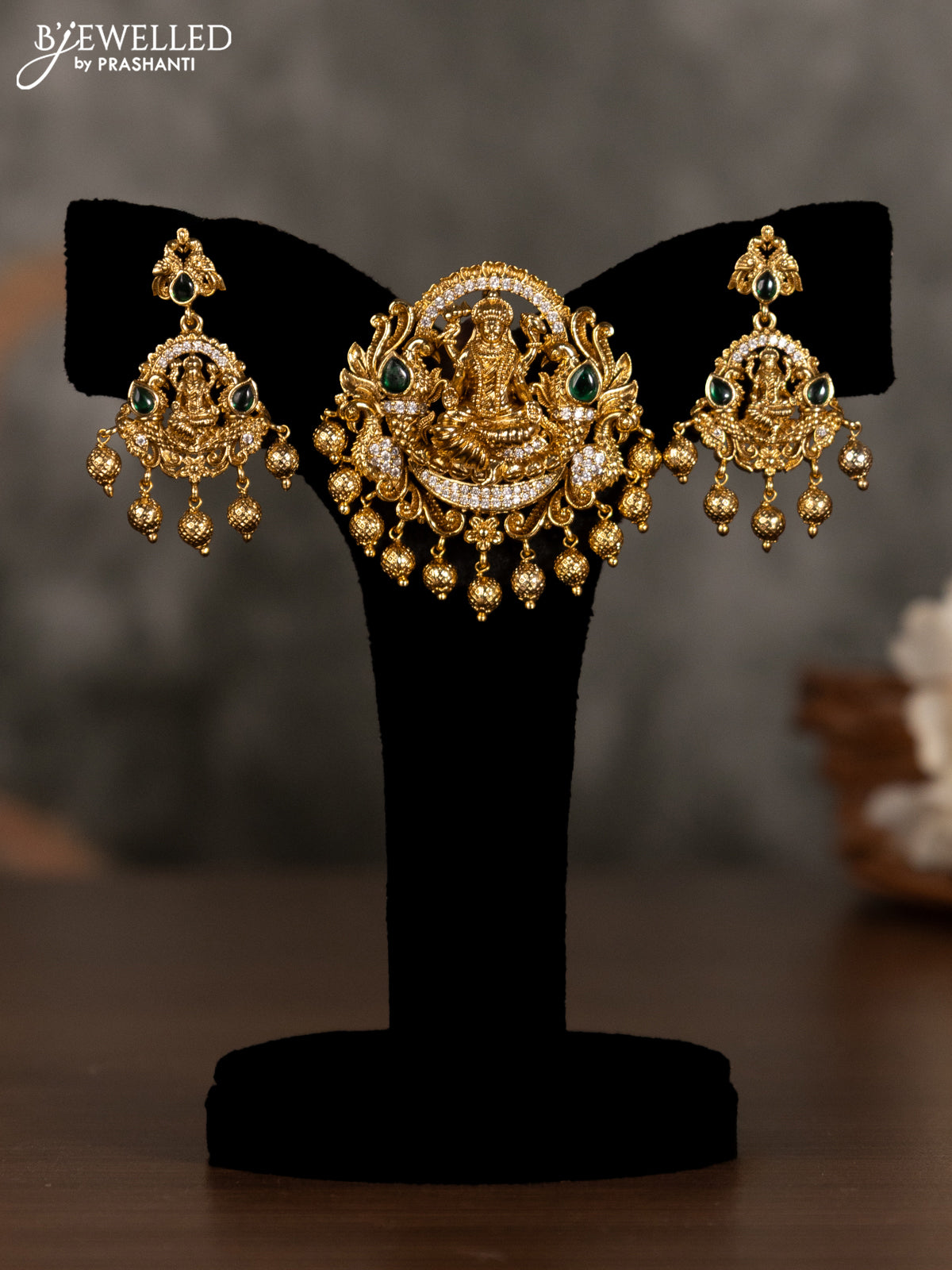 Antique pendant set lakshmi design with green kemp & cz stones and golden beads hanging