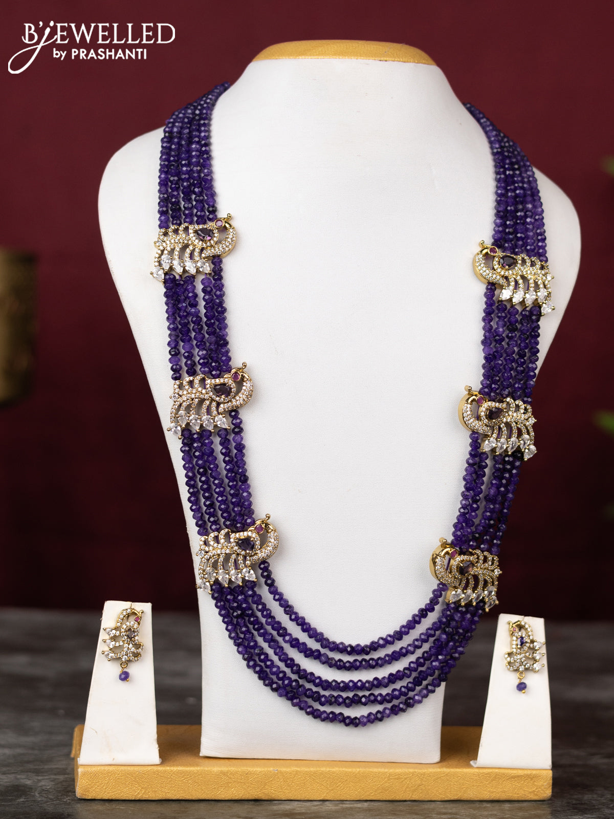 Beaded multilayer violet necklace with peacock side pendant and cz stones in victorian finish