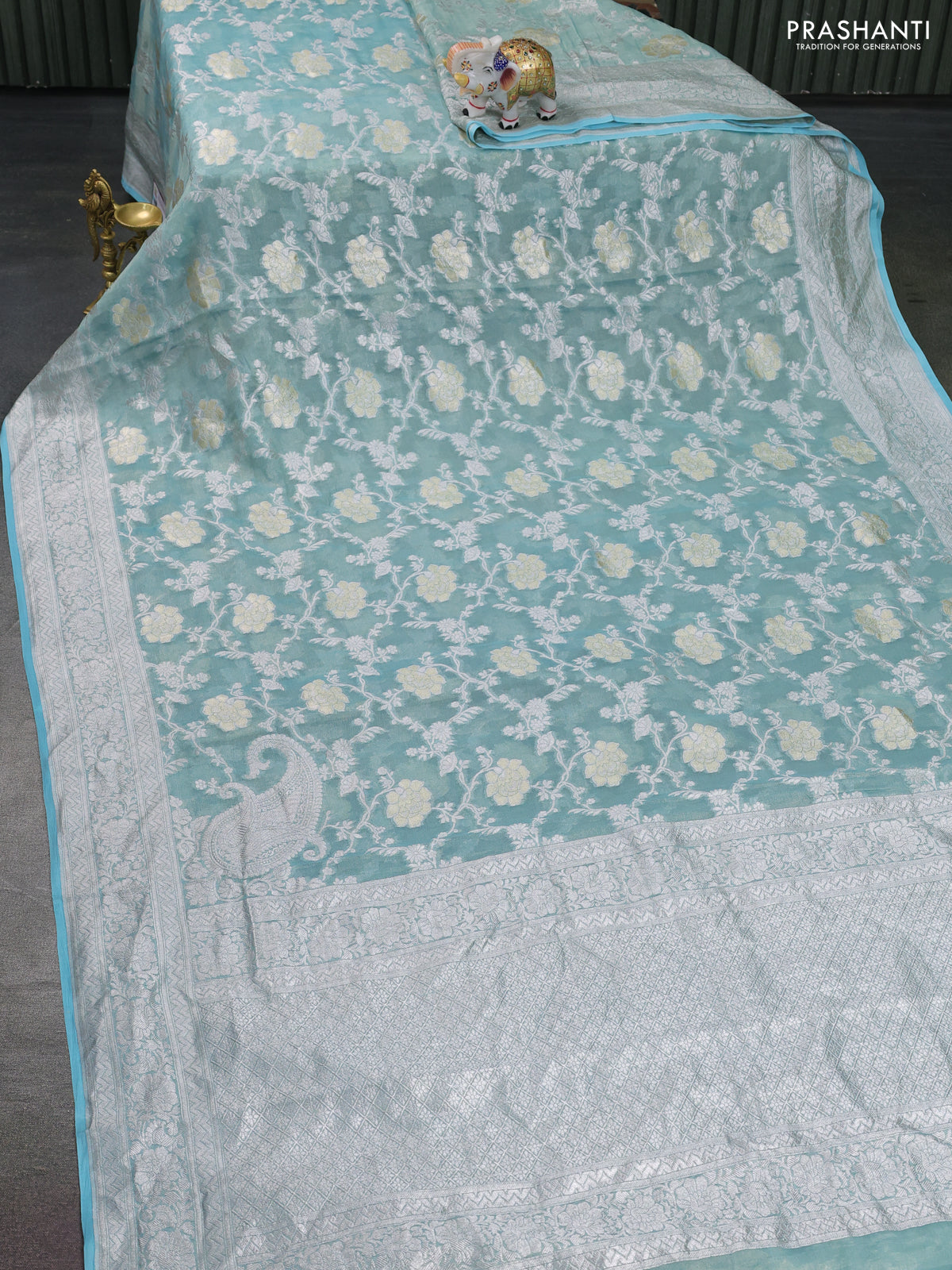 Banarasi georgette tissue saree teal shade and light blue with allover thread & silver zari floral weaves and silver woven border
