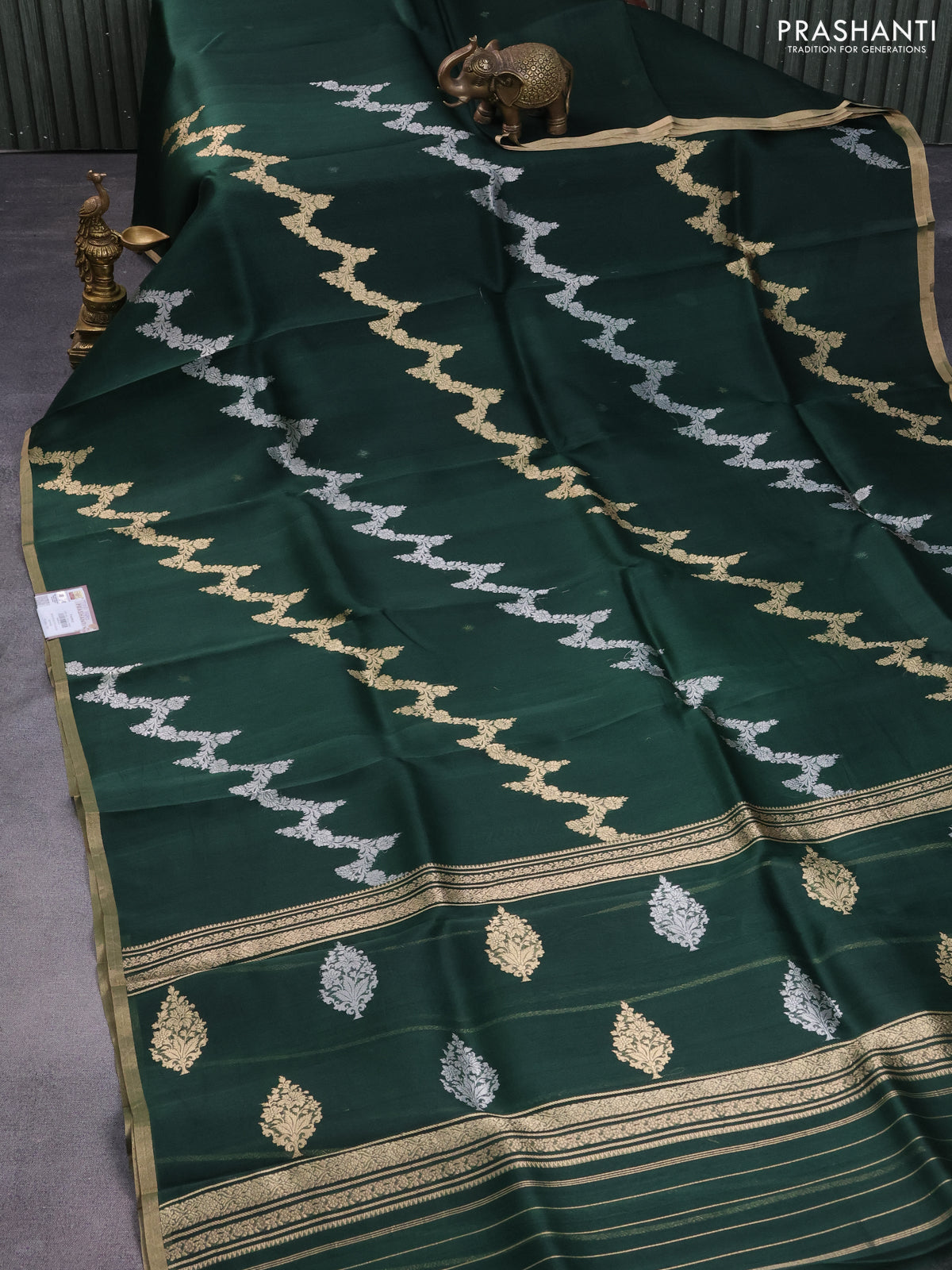 Banarasi organza silk saree bottle green with silver & gold zari weaves and zari woven piping border