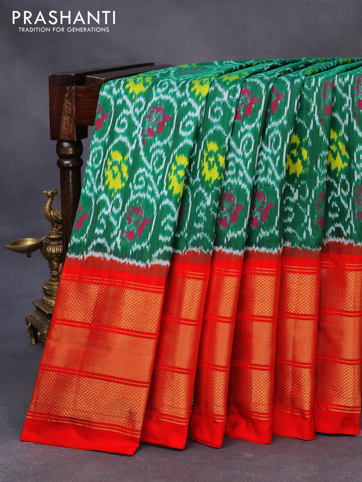 Pochampally silk saree green and orange with allover ikat weaves and long zari woven border