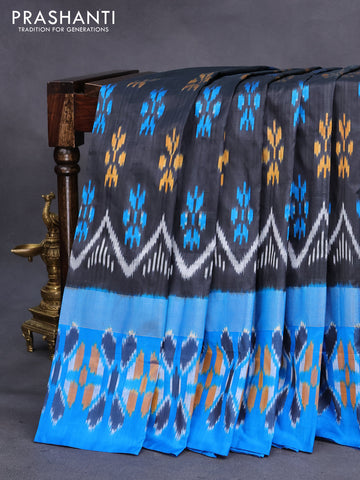 Pochampally silk saree black and cs blue with allover ikat butta weaves and long zari woven ikat border