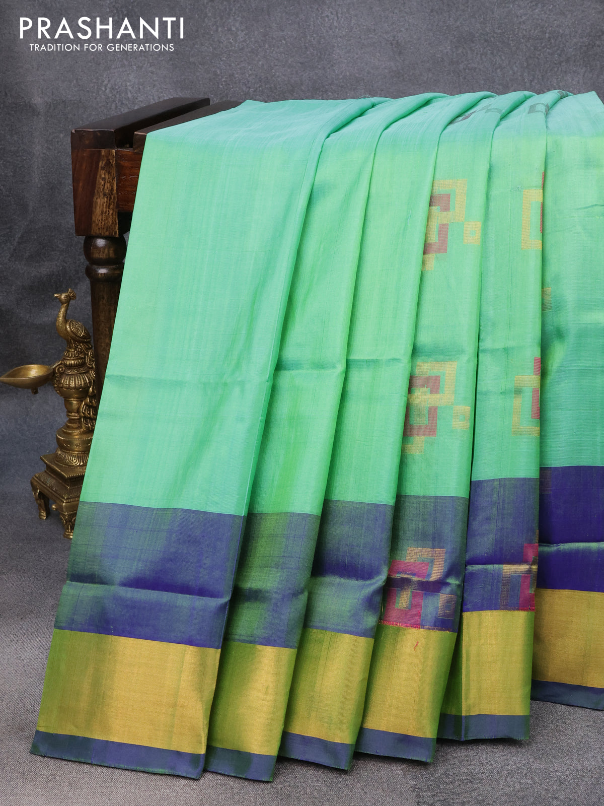 Pure uppada silk saree dual shade of green and blue with thread & zari woven geometric buttas and zari woven border