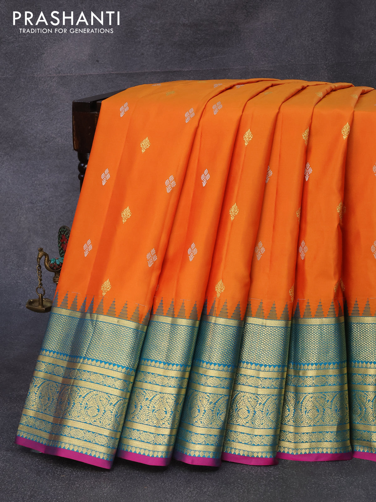 Pure gadwal silk saree orange and cs blue with silver & gold zari woven buttas and temple design zari woven border