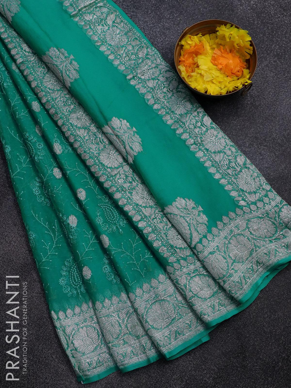 Banarasi chiffon saree teal blue shade   with allover chikankari work and silver zari woven border