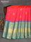 Pure gadwal silk saree dual shade of pinkish orange and teal blue with allover zari woven buttas and temple design long zari woven border