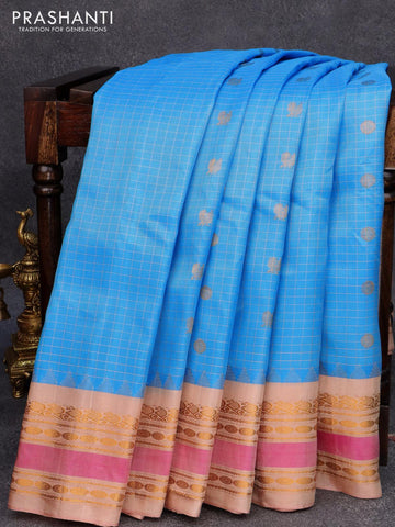 Pure gadwal silk saree light blue and sandal with allover checked & buttas and zari woven border